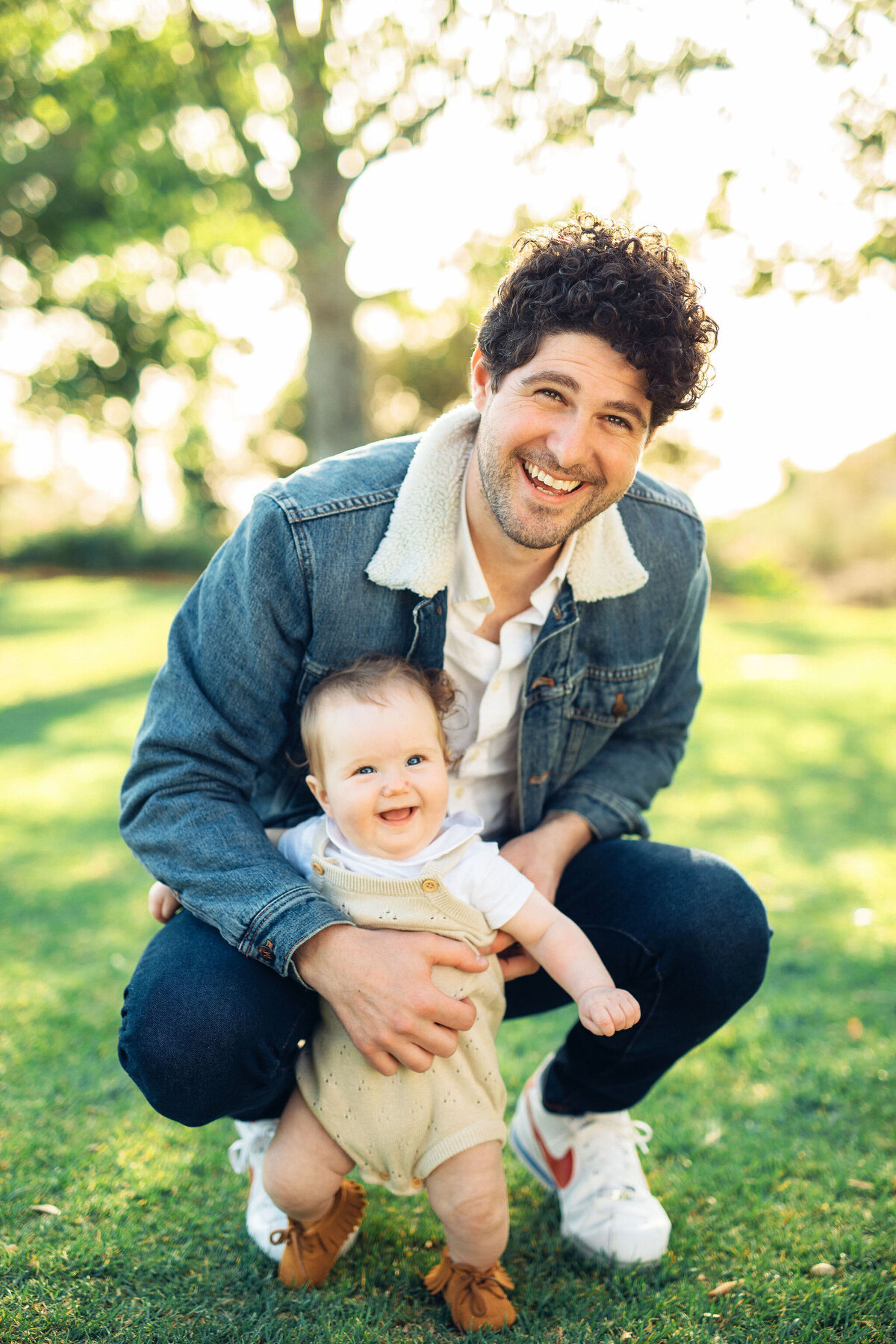 Family Portrait Photo Of Father Smiling With His Baby In Los Angeles