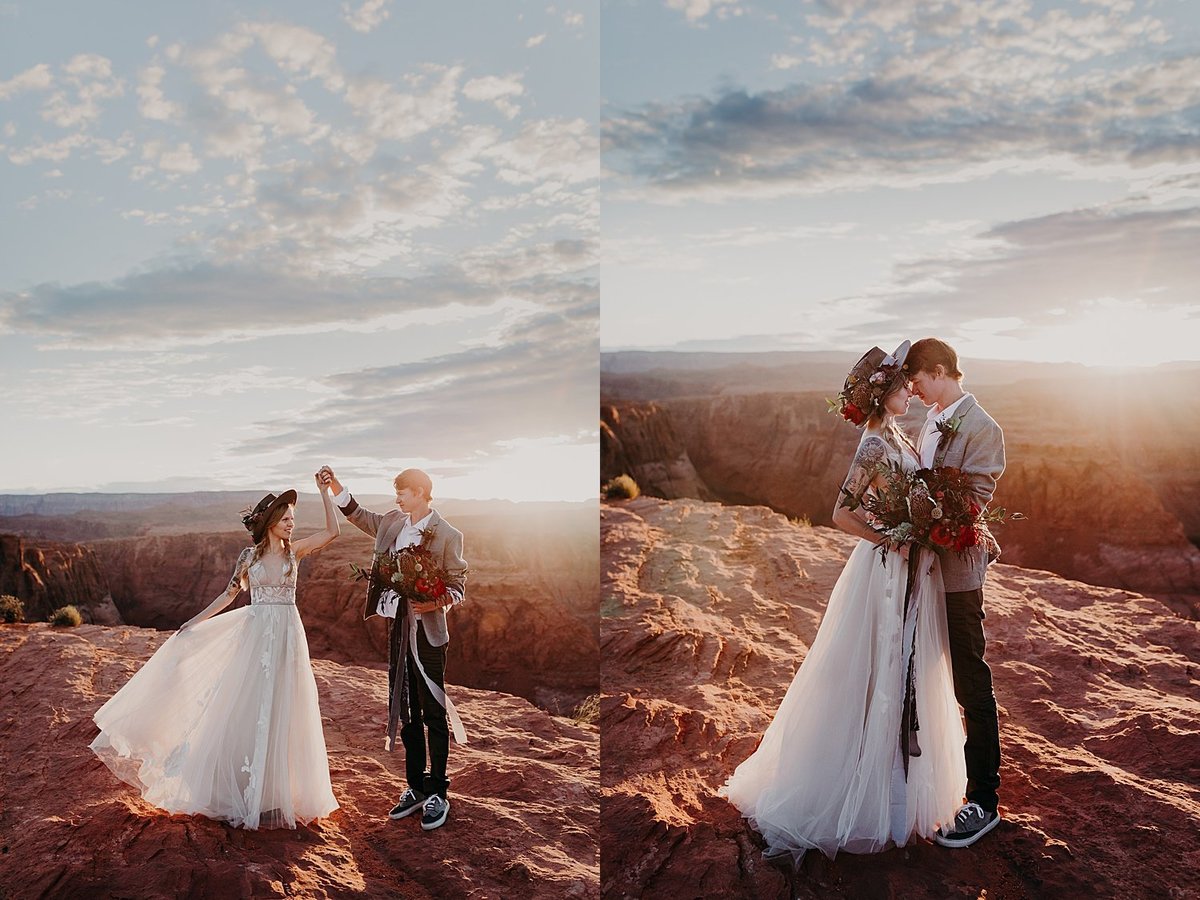 groom twirls bride in a flowered hat along the edge of a cliff in Page, Arizona