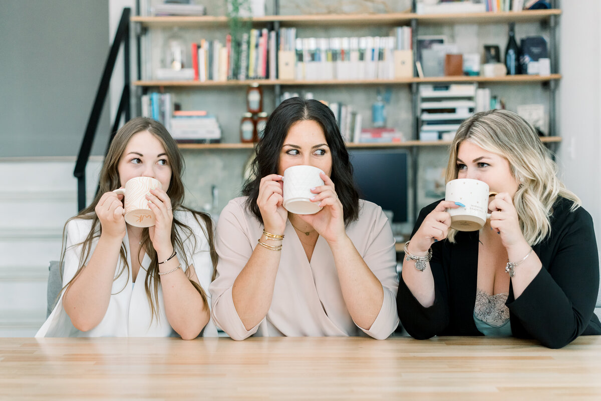 three women drinking coffee