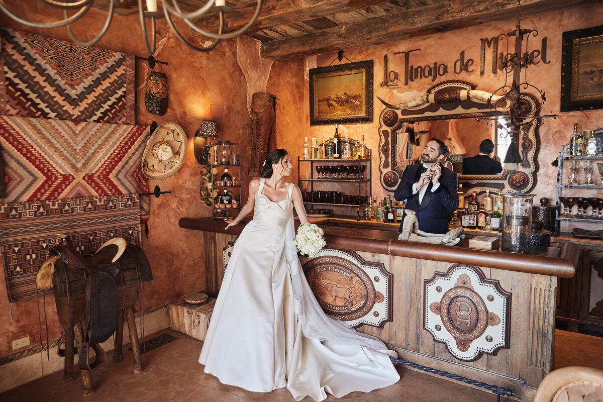Bride and groom portrait in rustic bar