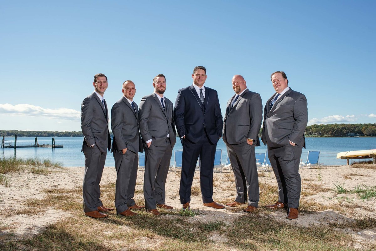 Groom and groomsmen by the water at The Ram's Head Inn
