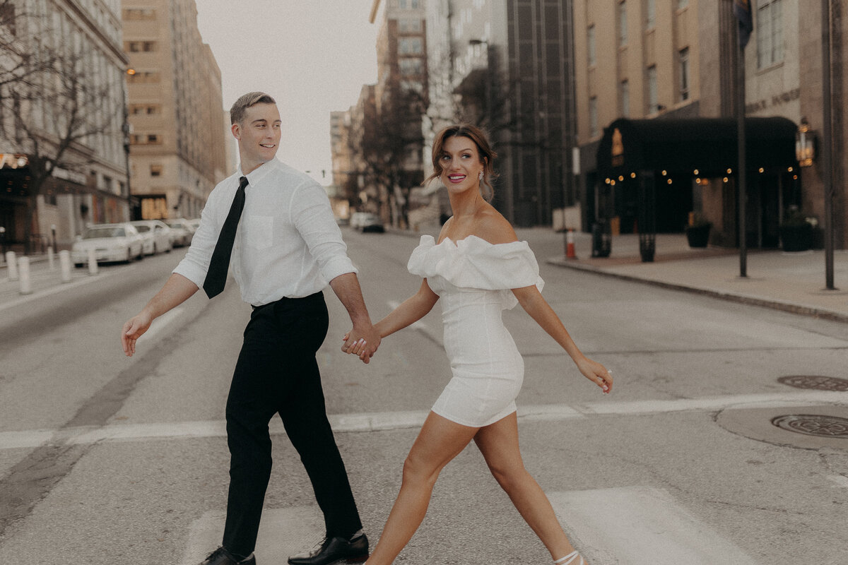 Dancing in the streets of downtown omaha for this editorial style engagement session