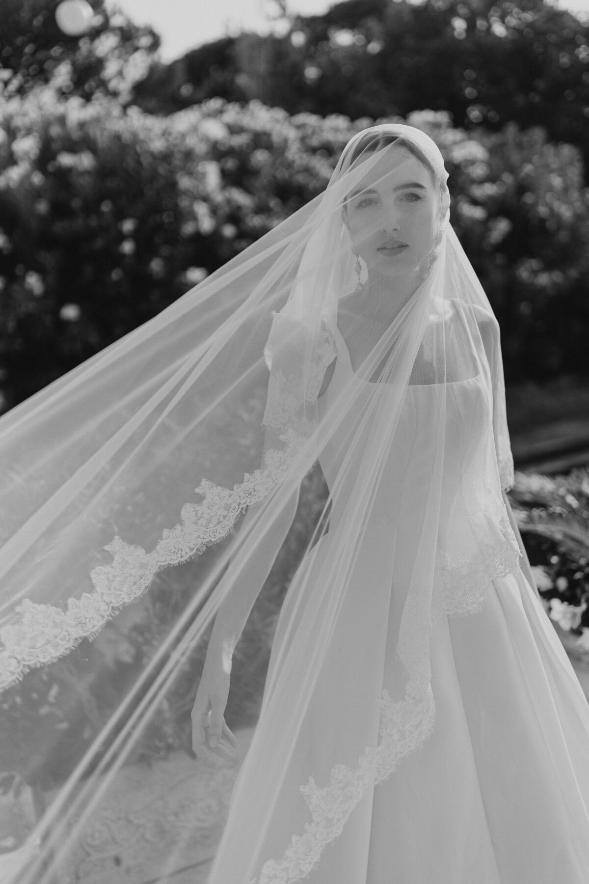 Bride with windblown veil.
