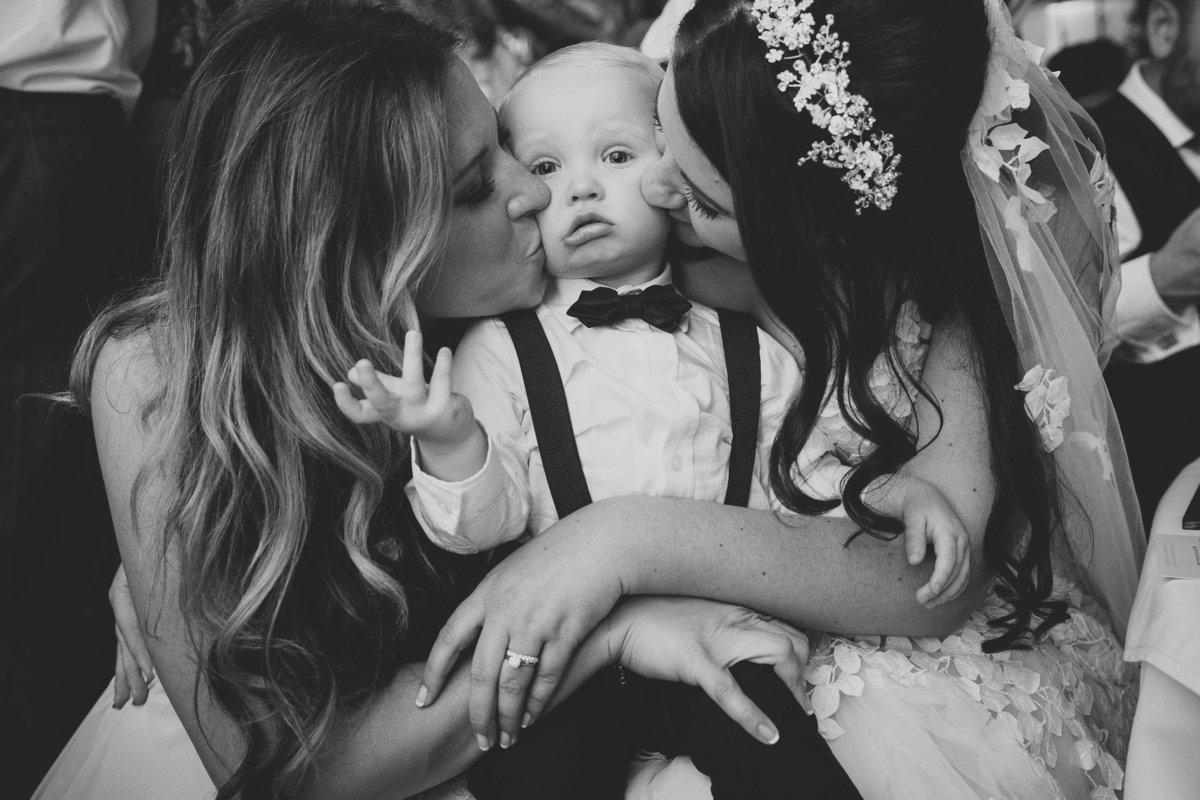 page boy being kissed by bride funny photo