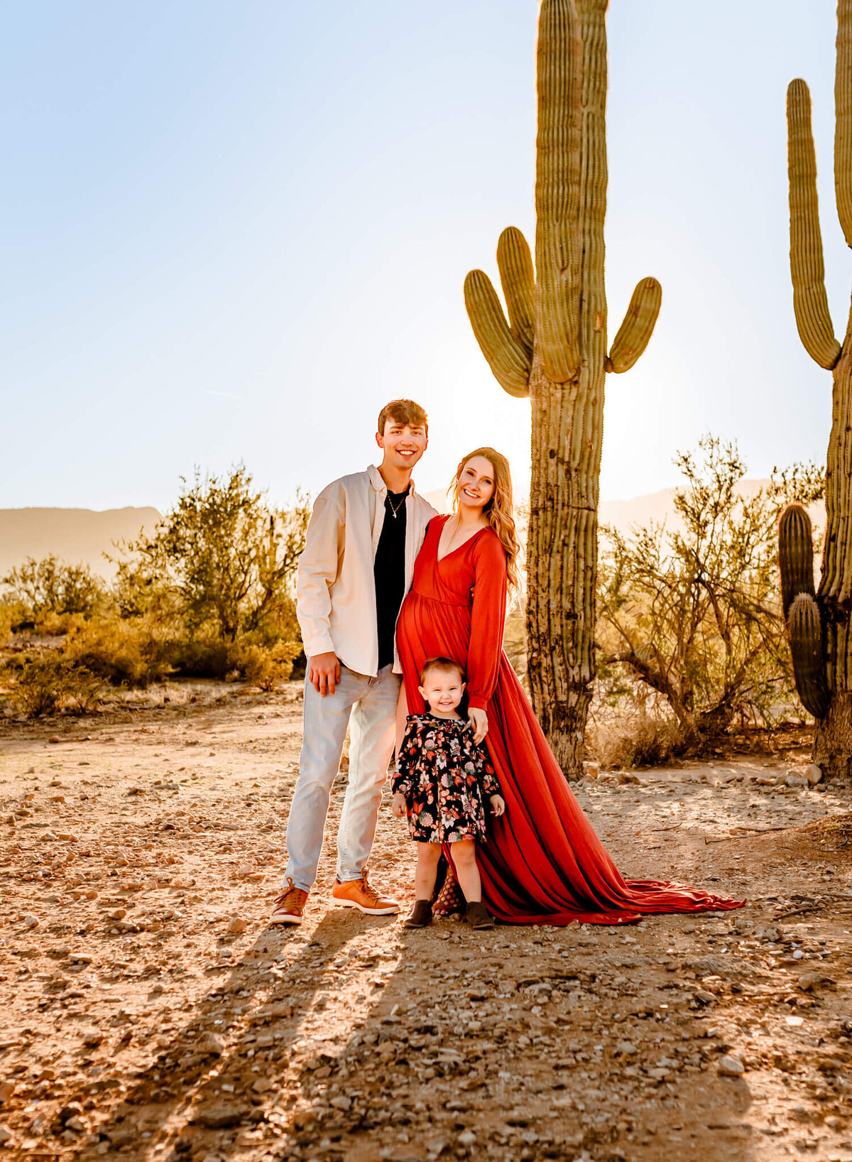 rust maternity dress in photographer client worn by AZ mom