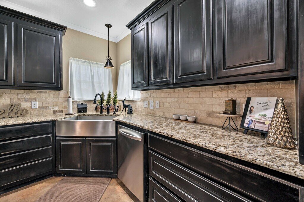 Kitchen with generous counter space in this four-bedroom, four-bathroom vacation rental home and guest house with free WiFi, fully equipped kitchen, firepit and room for 10 in Waco, TX.