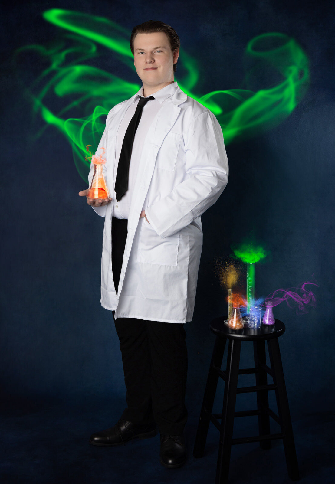 senior-boy-in-lab-coat-with-beakers-of-smoke