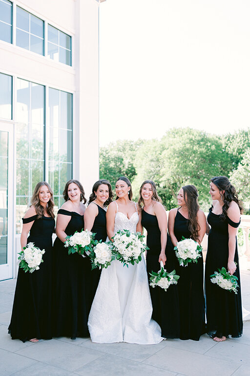 Bride with bridesmaids wearing black dresses at luxury wedding at Senatra, Dallas