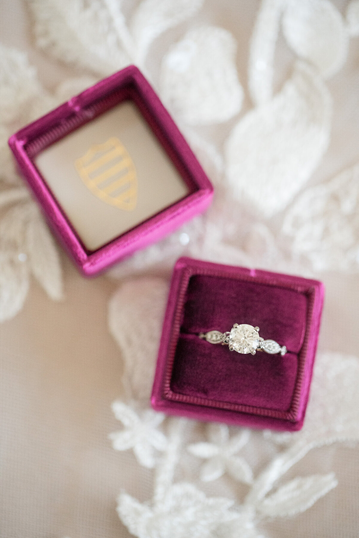 diamond wedding ring in a magenta velvet ring box