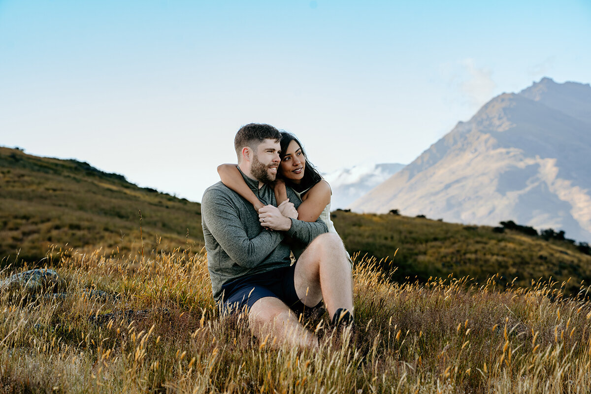 Couple hugging during a honeymoon photoshoot in Queenstown, New Zealand