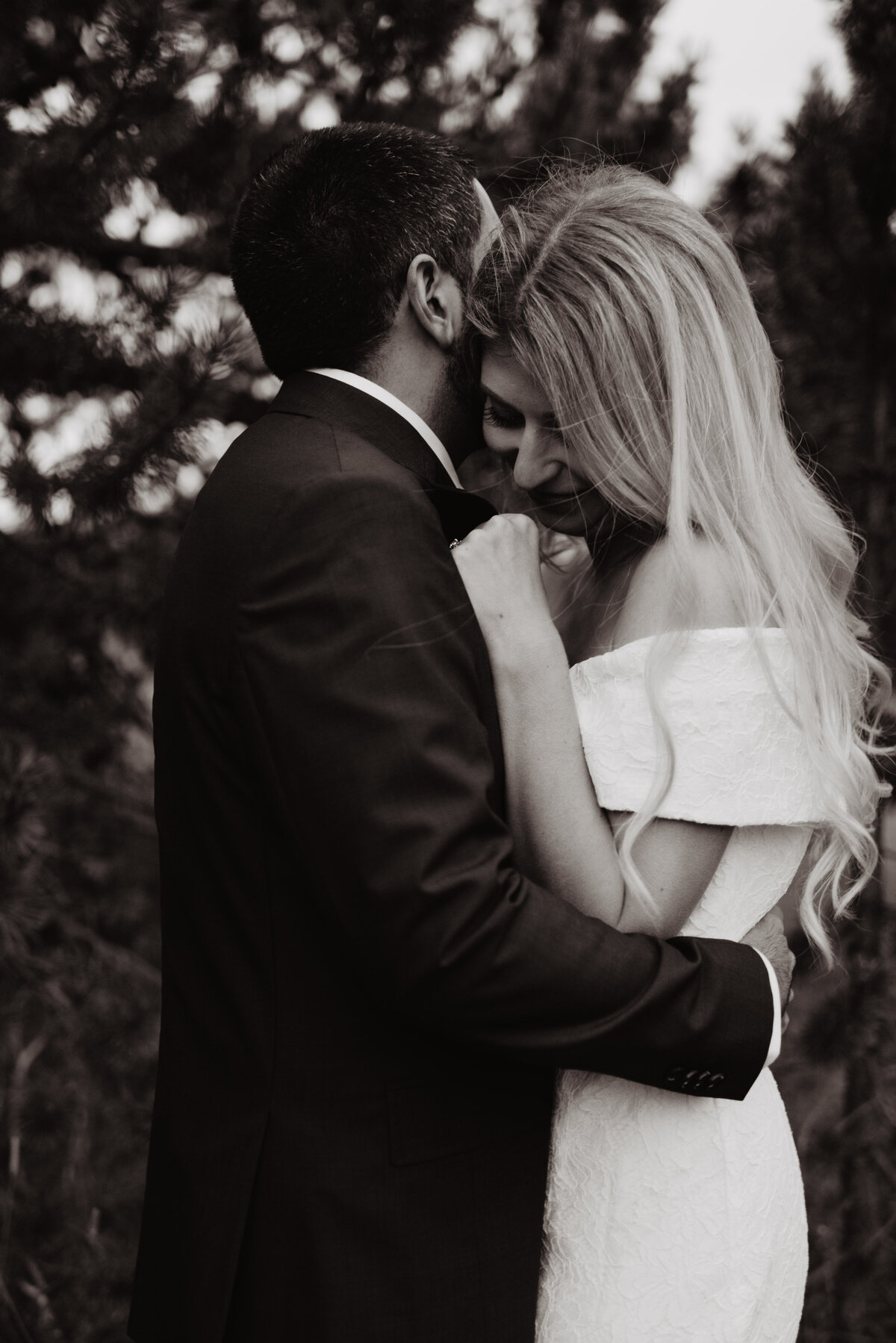 Photographers Jackson Hole capture groom snuggling bride