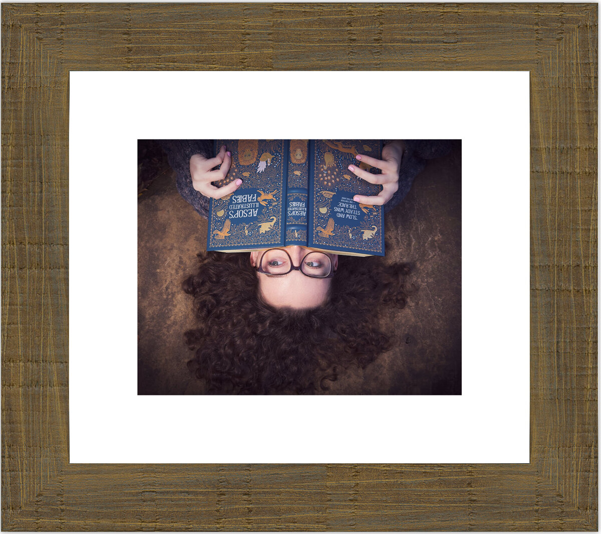 Senior Cali loves to read, even when upside down or on a rock! Mounted on a Rustic frame with  White Mat