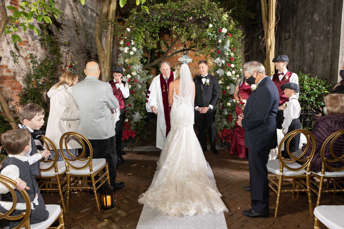 Alicia and Chip's wedding ceremony in the courtyard of the Pharmacy Museum in New Orleans, Louisiana.