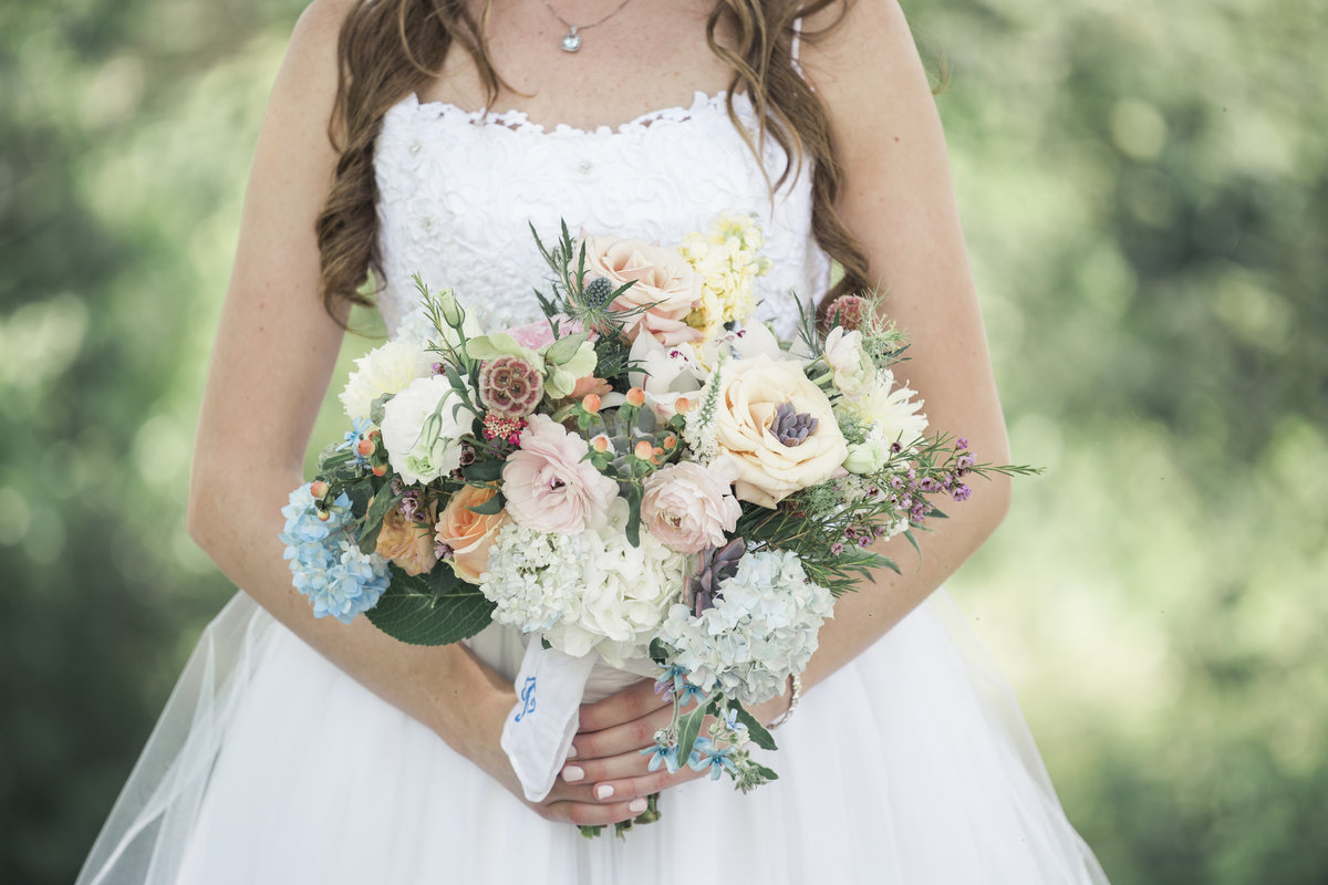Beautiful, full bridal bouquet at spring wedding in Charlotte NC