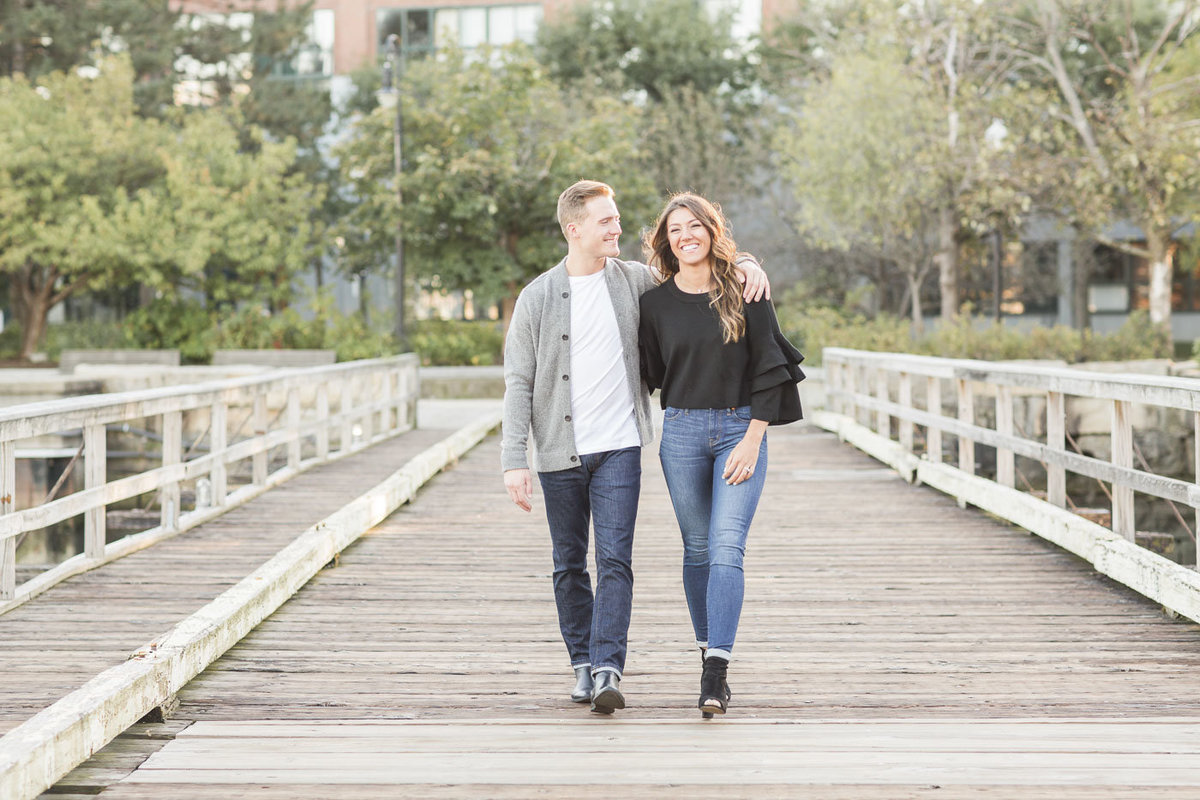 couple walking across a bridge