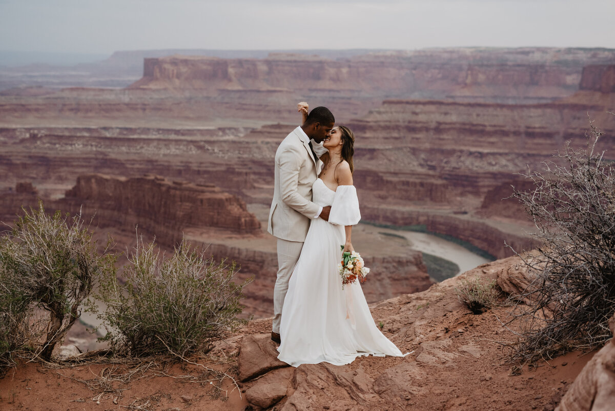 Utah Elopement Photographer captures bride holding groom's head