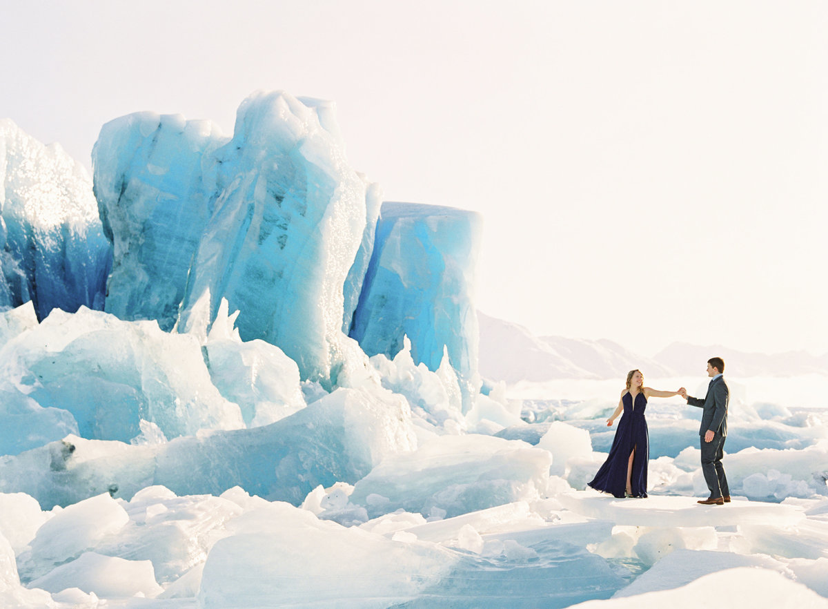 Couple dancing on Knik Glacier during engagement.