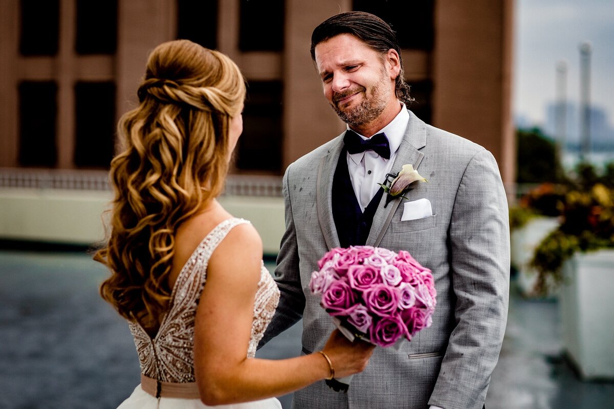 A groom reacts to seeing his bride during a W Hotel wedding.