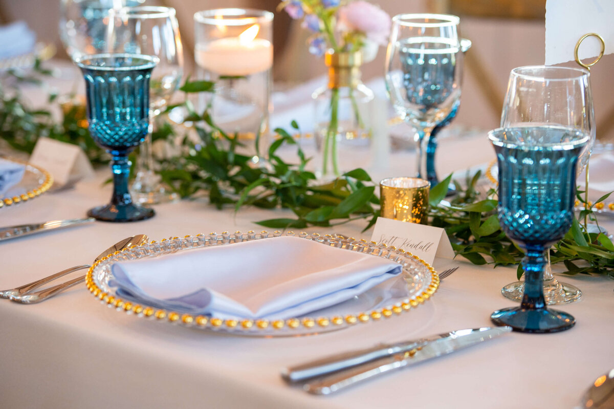 a photo of blue table setting decor for an Ottawa wedding at Stonefields Estate Loft