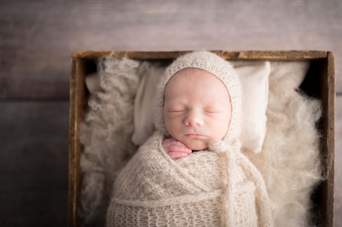 Baby boy wrapped in cream sleeping at Always Images South Bend photographer