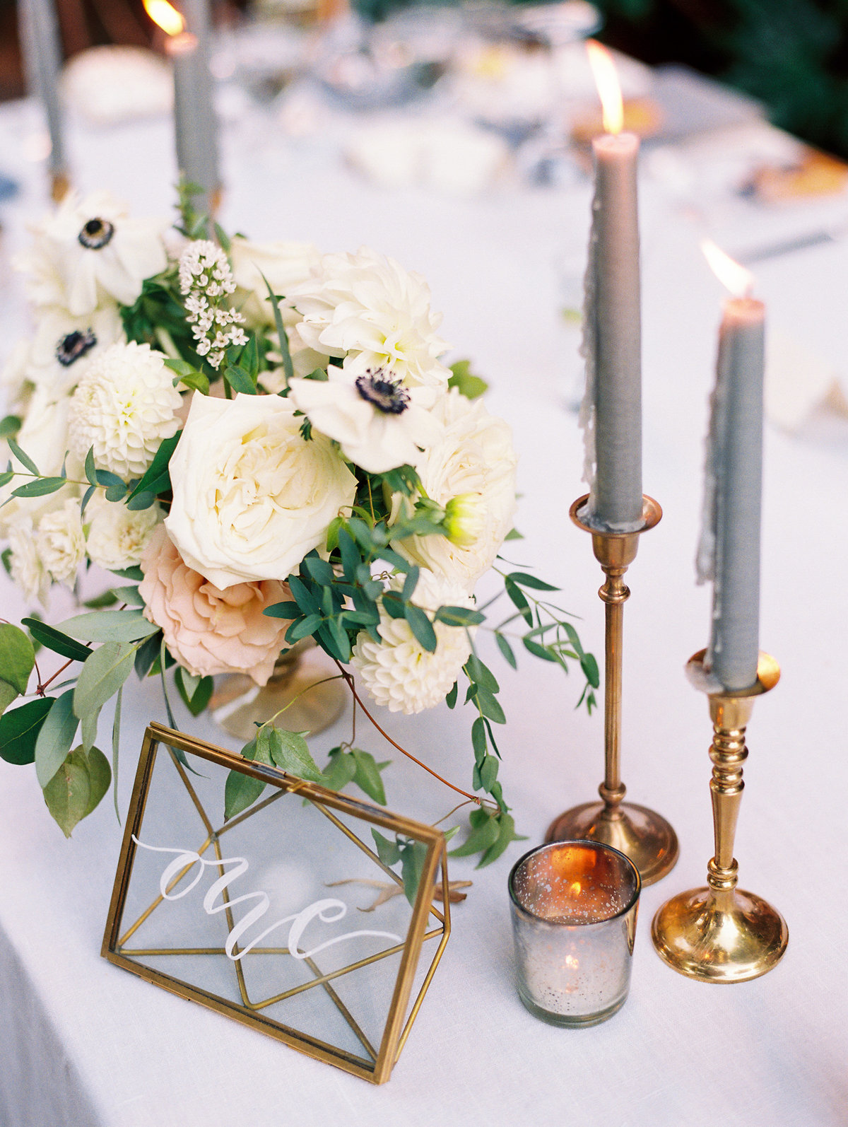 candles and flower centerpiece at a portland wedding