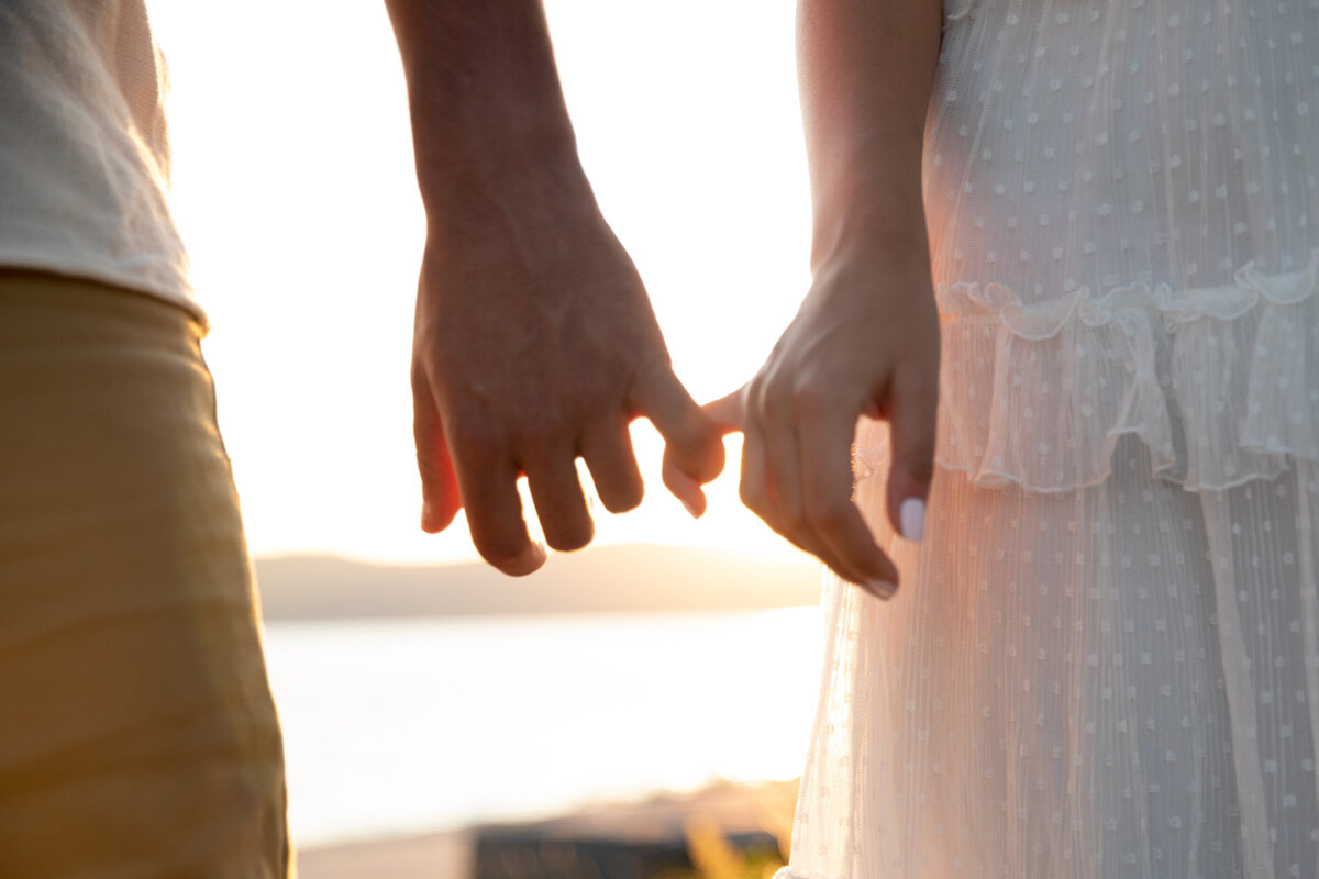 Detail shot of two people holding hands linked by their pinky fingers engagement session New York wedding photographer