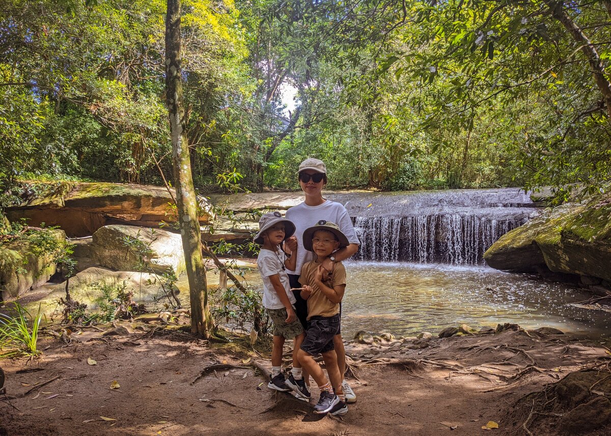 Story Lens Photography posing at waterfall with twin boys