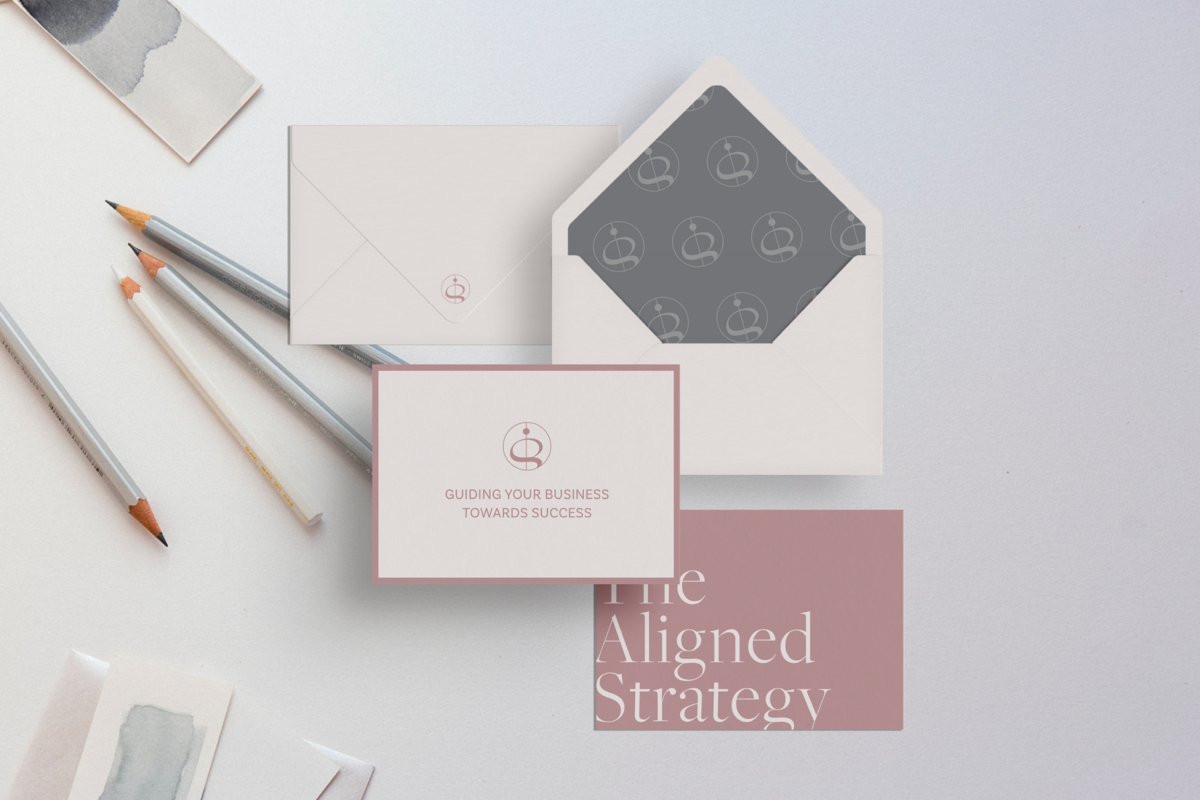Brand identity mockup with branded envelope and postcard on white background with gray gradient color swatch, silver and white pencils by Knoxville agency Liberty Type