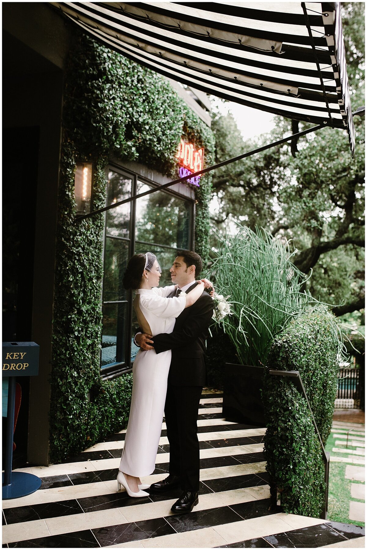 Bride and groom embracing in the grounds of hotel saint cecilia Austin