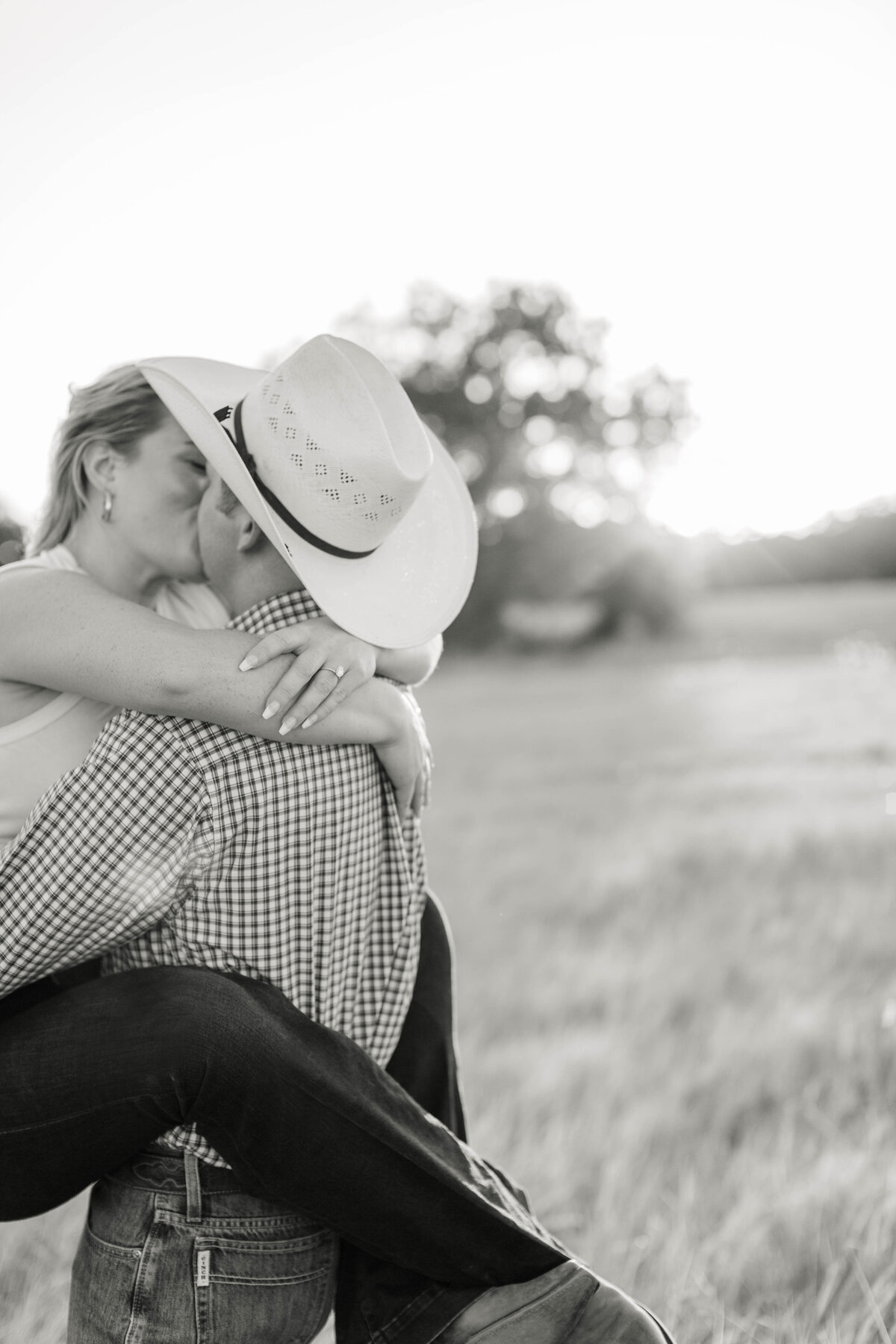 texas couple kissing during engagement photoshoot
