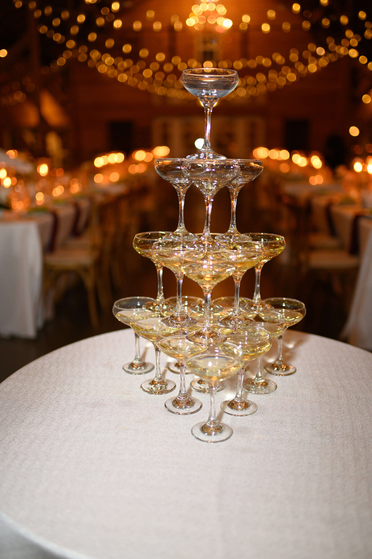 Full flash image of a champagne tower at a wedding reception