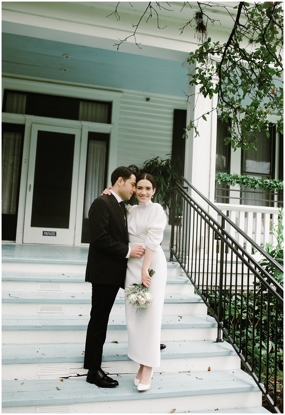 Bride and groom on the steps of hotel Saint Cecilia Austin