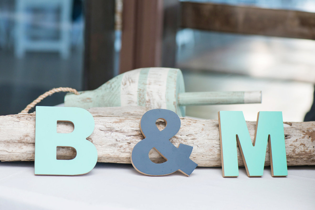 engraved letter decorations of bride and groom initials from wedding at Pavilion at Sunken Meadow
