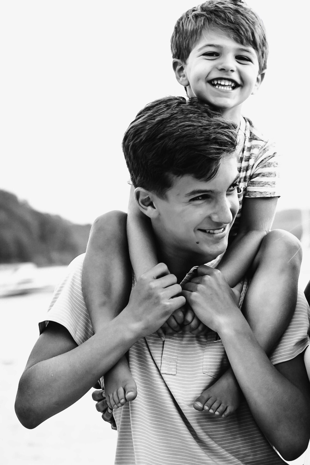 Little brother on shoulders during long island family portraits