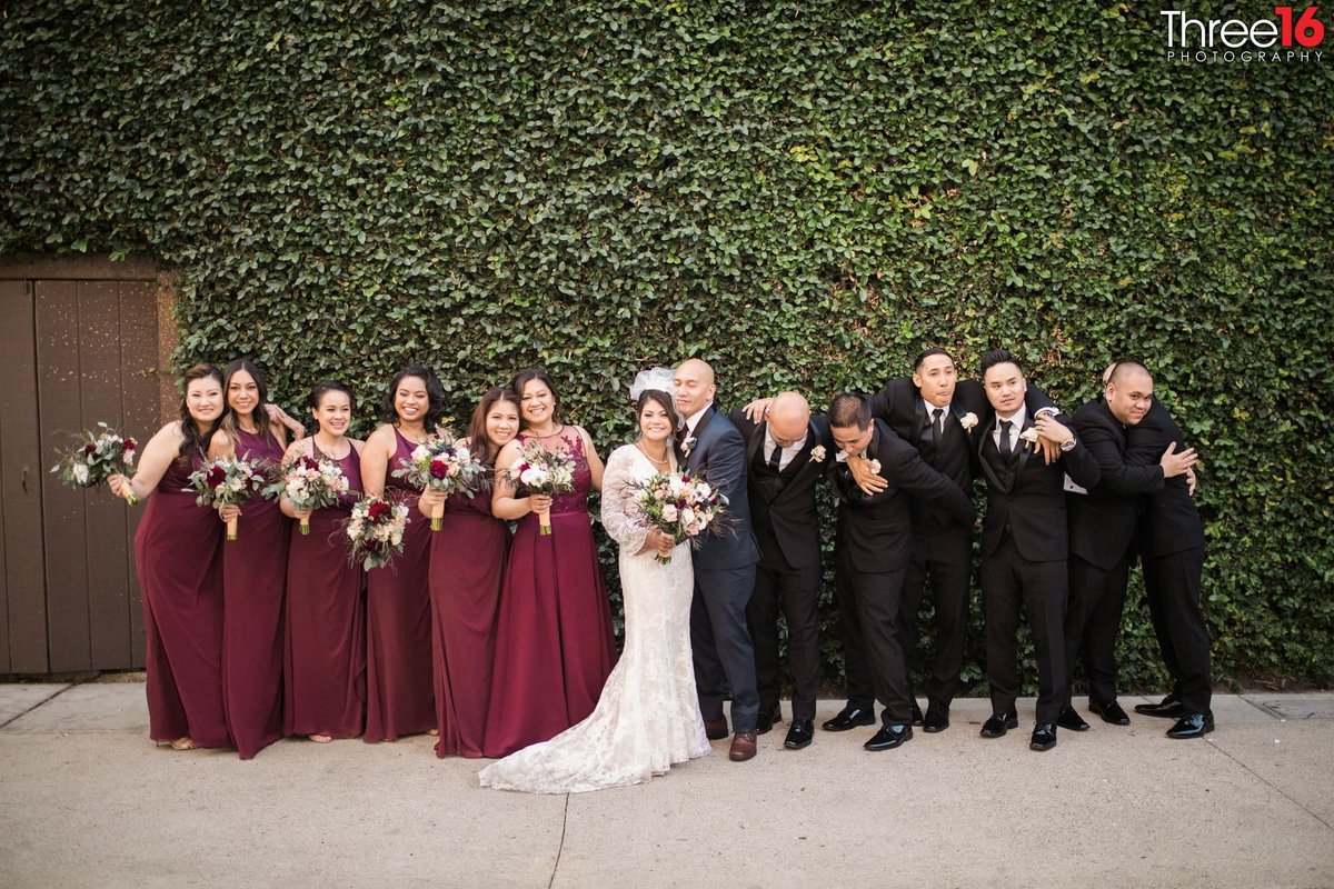 Bridal Party goofs off with the Bride and Groom
