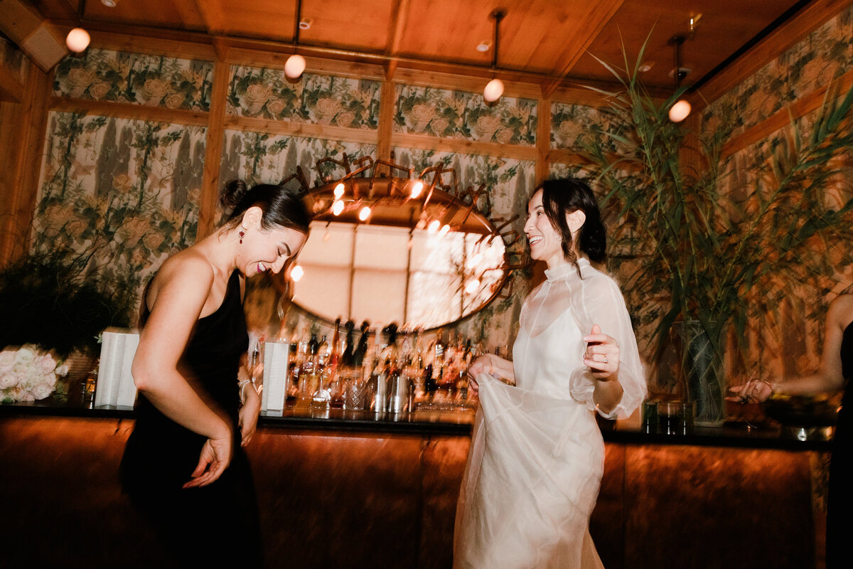 Bride with friend at the bar at the Proper hotel Austin