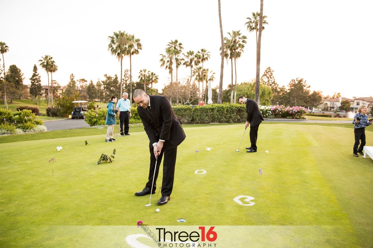 Groomsmen get a little putting practice in before the ceremony