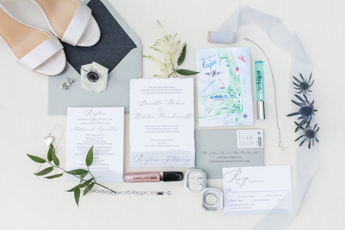 invitation suite and bridal details  lay flat