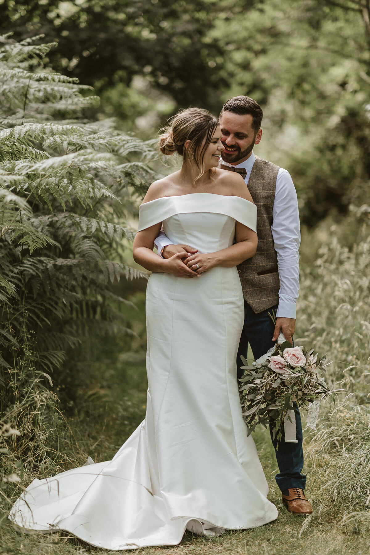 bride and groom in the woods