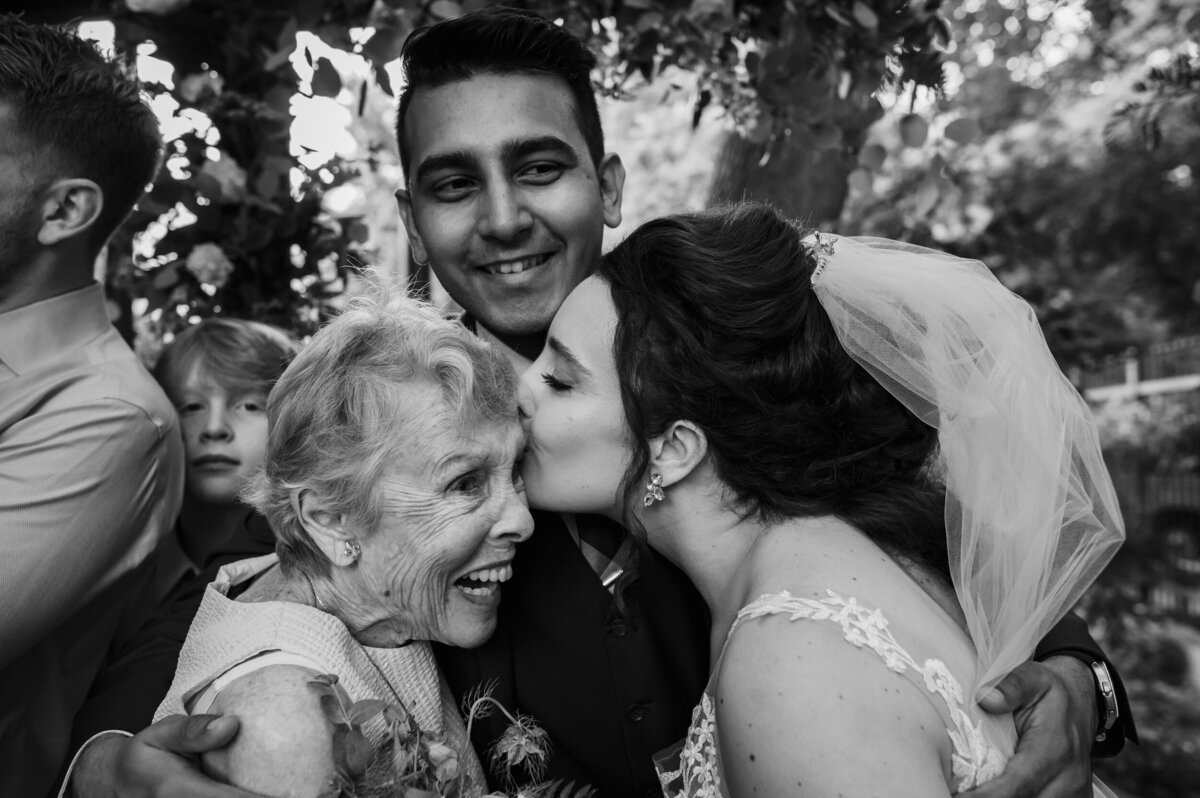 Bride kisses her grandpa on her wedding day