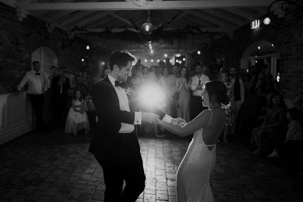Bride and Groom kissing in front of sparklers