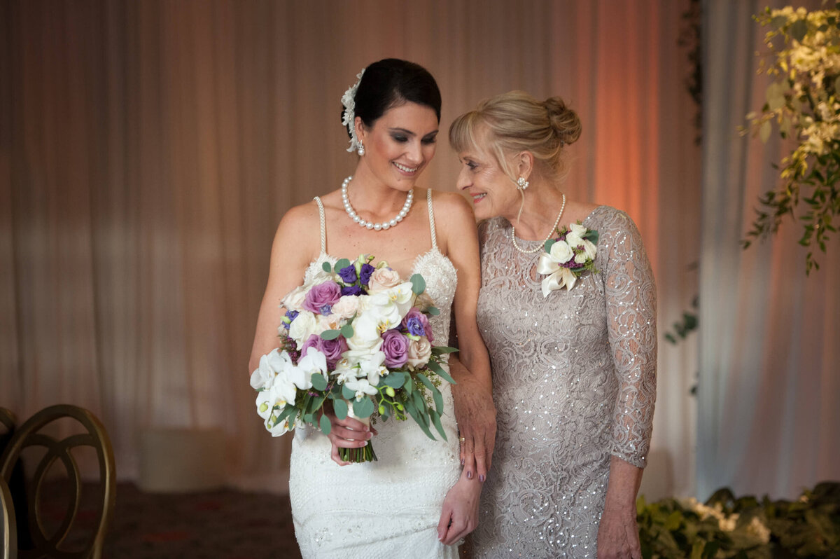 Bride and her mother about to walk down the isle
