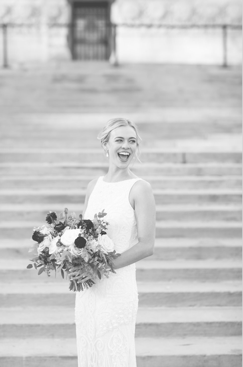 portrait of bride on wedding venue steps