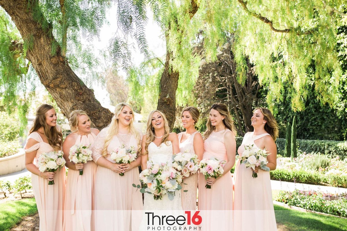 Bride and Bridesmaids share a laugh on the grounds of the Richard Nixon Library