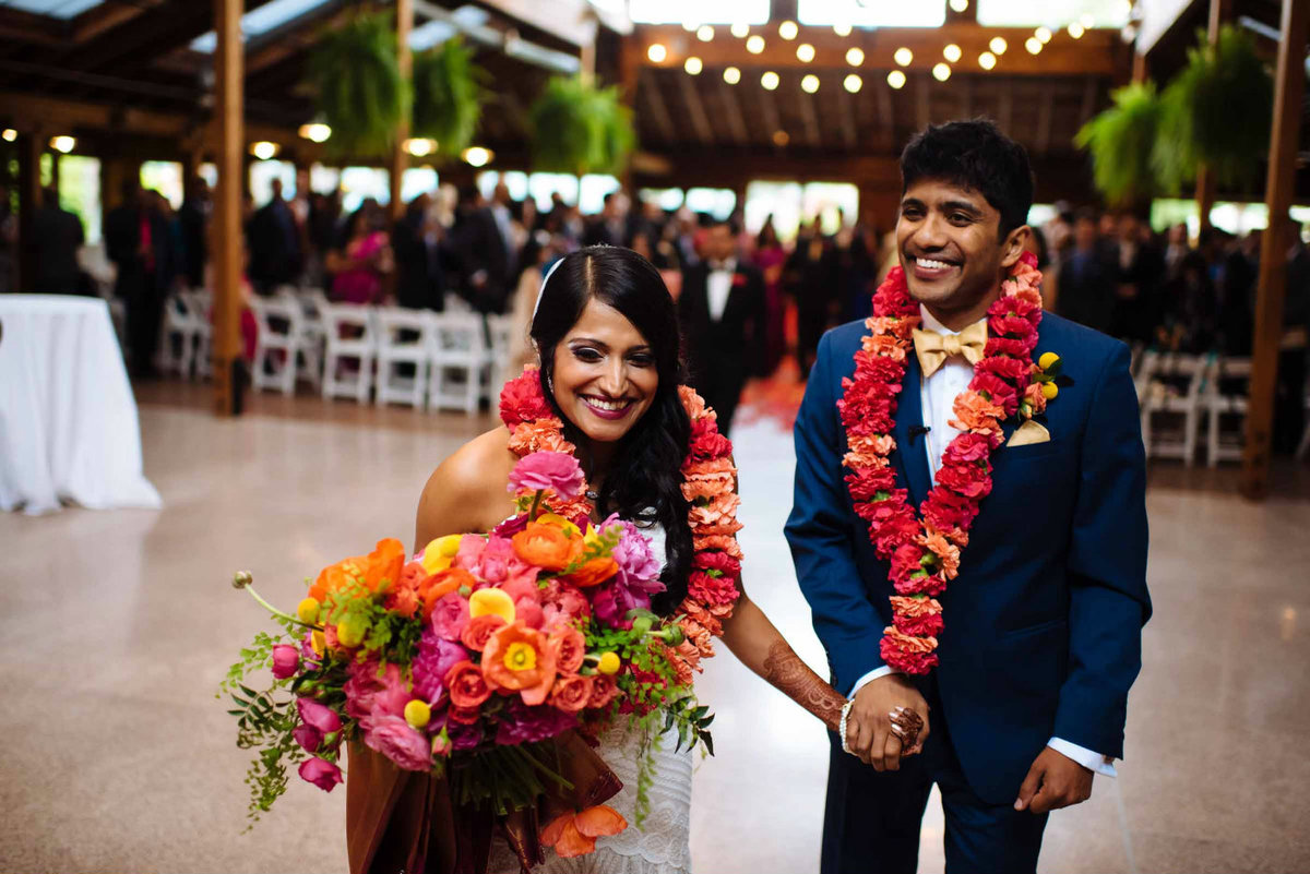 Our stunning and happy couple match the cheerful vibe of these bright flowers.
