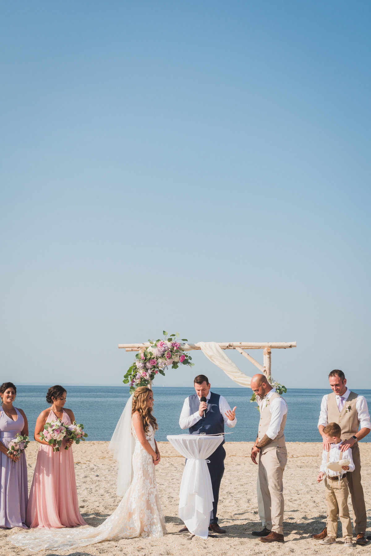 photo of ceremony on the beach from wedding at Pavilion at Sunken Meadow