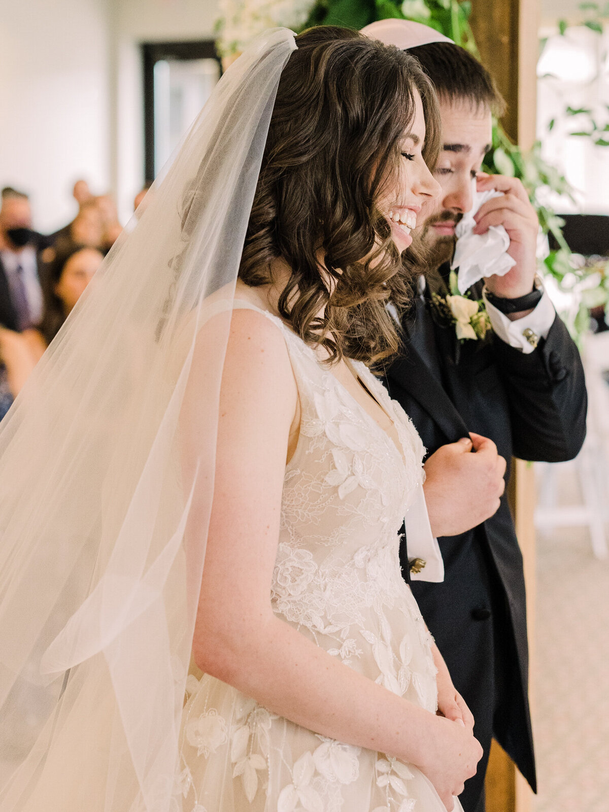 A groom sheds a tear during his Jewish wedding ceremony in Chicago