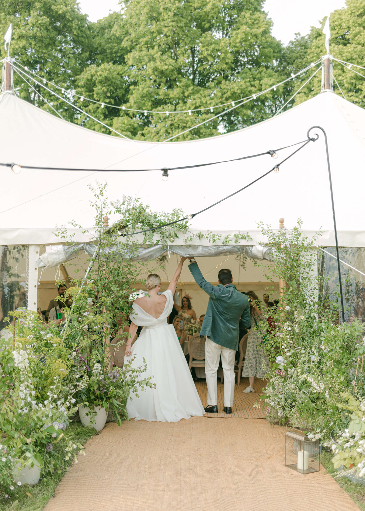 chloe-winstanley-weddings-cotswolds-cornwell-manor-bride-groom-sperry-tent-entrance