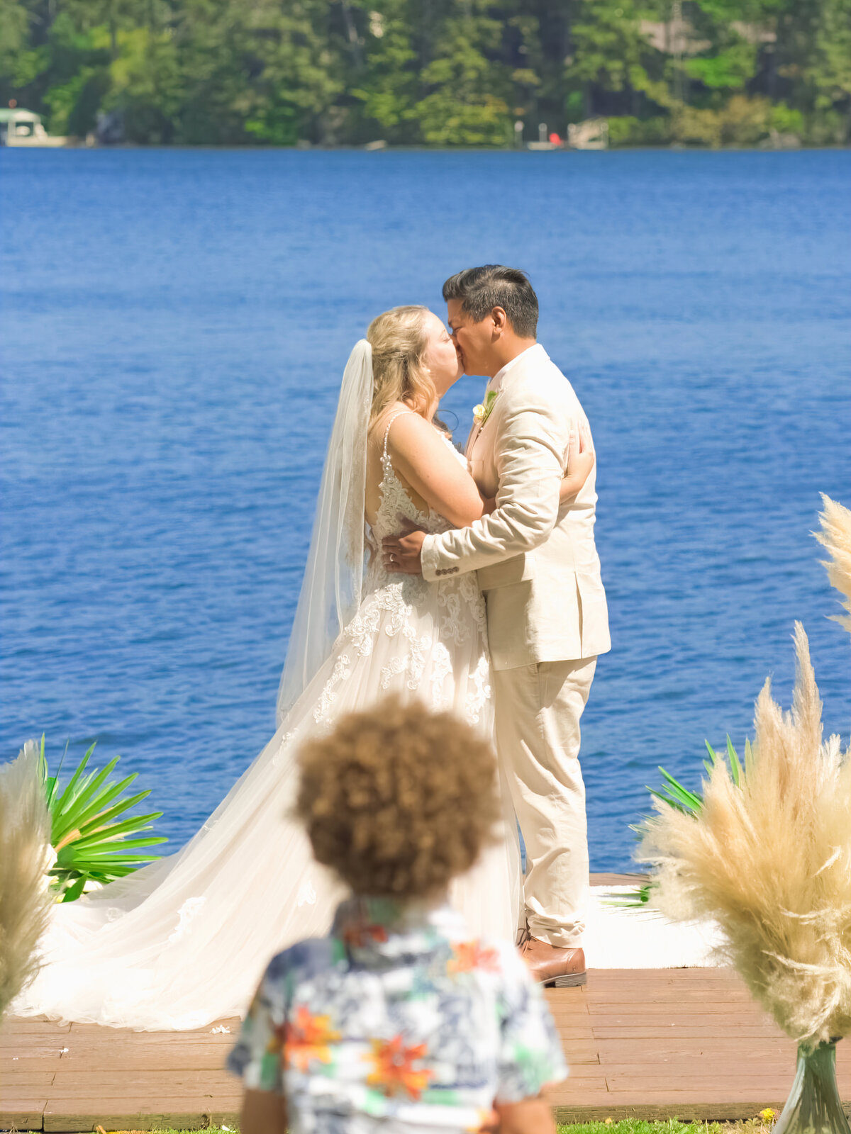 An unusual shot of a first kiss during a Tahoe wedding
