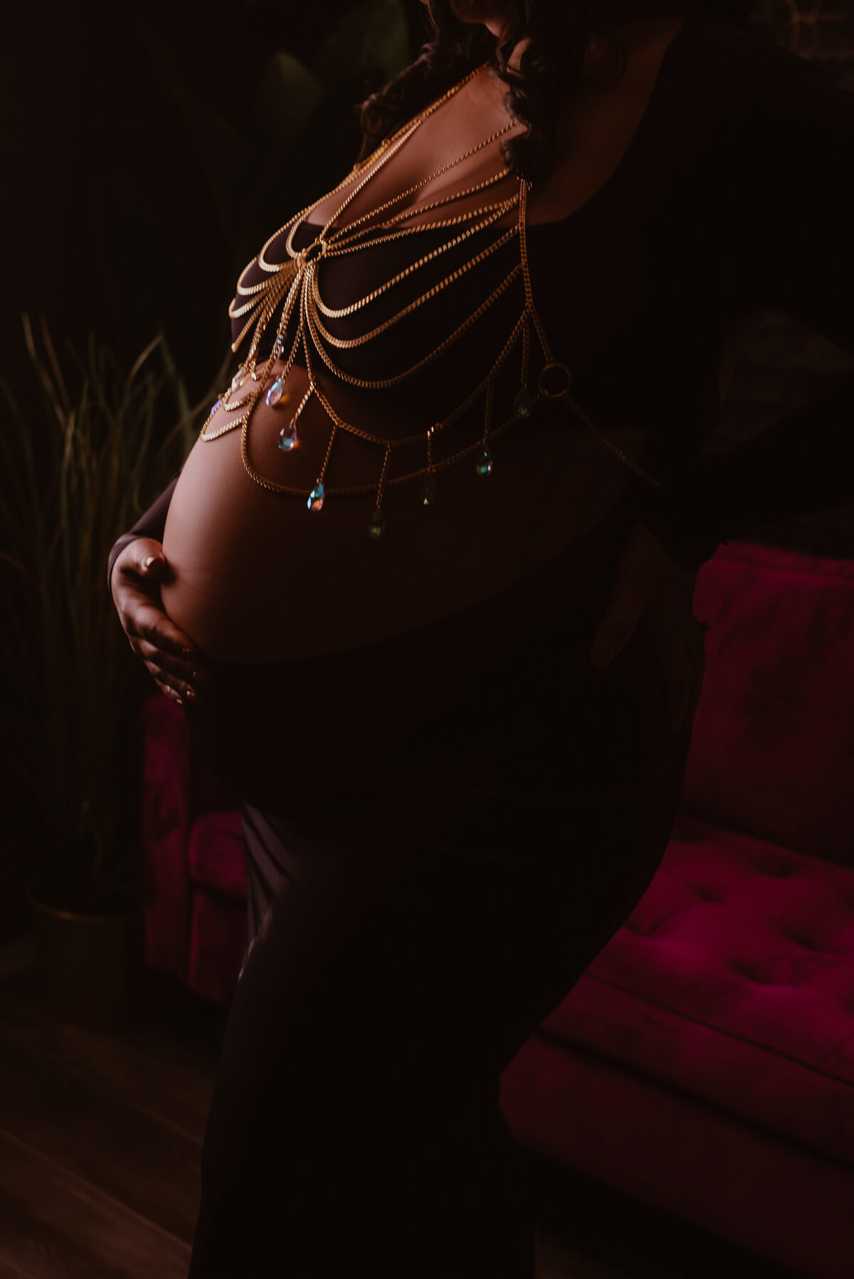 women in black dress and body chains